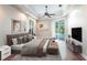 This main bedroom has tray ceiling, and sliding glass doors leading to a pool at 4915 Old Tree Pl, Sarasota, FL 34233