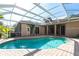 Inviting screened pool with brick patio offers a relaxing outdoor space and complements the home's architecture at 4915 Old Tree Pl, Sarasota, FL 34233