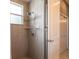Shower with tiled walls, shower head, soap dish, and tiled shower floor at 4915 Old Tree Pl, Sarasota, FL 34233
