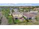Aerial view showcases the home’s backyard with a patio area and mature landscaping within a desirable neighborhood at 5522 Cartagena Dr, Sarasota, FL 34233