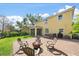 Backyard with outdoor seating and spa overlooking a lake and other backyards at 5522 Cartagena Dr, Sarasota, FL 34233