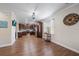 Bright kitchen with stainless steel appliances, wooden cabinets, granite counters, tile backsplash and hardwood floors at 5522 Cartagena Dr, Sarasota, FL 34233