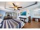 This spacious main bedroom features wood floors, trey ceilings, and a mounted TV at 5522 Cartagena Dr, Sarasota, FL 34233
