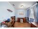 This home office features wood floors, a large window, and light blue walls at 5522 Cartagena Dr, Sarasota, FL 34233
