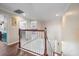 Bright upstairs hallway featuring wood floors, white railings, and an open view to the staircase at 5522 Cartagena Dr, Sarasota, FL 34233
