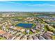 Aerial view of a beautiful community with many homes and picturesque ponds at 5590 Rain Lily Ct, Sarasota, FL 34238