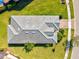 Aerial view of home featuring a well-maintained roof and a lush green lawn at 5590 Rain Lily Ct, Sarasota, FL 34238