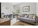 This bedroom features a daybed, desk area, natural light from window, and neutral color palette at 5590 Rain Lily Ct, Sarasota, FL 34238