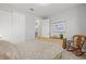 Comfortable bedroom with neutral colors, closet, and a decorative picture frame at 5590 Rain Lily Ct, Sarasota, FL 34238