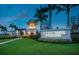 Community entrance with lush landscaping, elegant lighting, and Hammock Preserve signage at 5590 Rain Lily Ct, Sarasota, FL 34238