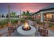 Community fire pit with Adirondack chairs for residents and guests to enjoy at 5590 Rain Lily Ct, Sarasota, FL 34238