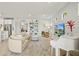 Cozy living room featuring modern furnishings and built in bookcase at 5590 Rain Lily Ct, Sarasota, FL 34238
