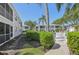 Exterior of the community with lush landscaping, providing privacy and a serene atmosphere at 5647 Sheffield Greene Cir # 29, Sarasota, FL 34235
