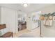 Bright foyer leading to the living room and kitchen, showcasing the open floor plan and stylish decor at 5647 Sheffield Greene Cir # 29, Sarasota, FL 34235