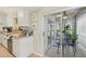 Galley kitchen with access to the enclosed lanai at 5647 Sheffield Greene Cir # 29, Sarasota, FL 34235