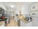 Bright kitchen with granite countertops and stainless steel appliances at 5647 Sheffield Greene Cir # 29, Sarasota, FL 34235