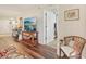 Cozy living room with hardwood floors, a media center, and comfortable seating at 5647 Sheffield Greene Cir # 29, Sarasota, FL 34235