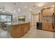 Open-concept kitchen with granite countertops, stainless steel appliances, and modern lighting at 568 Sheridan Dr, Venice, FL 34293