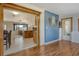 Open floor plan showcasing kitchen and dining area leading into a living room with blue accent wall at 568 Sheridan Dr, Venice, FL 34293