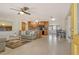Open-concept living room and kitchen with wood cabinets and a view of the front door at 568 Sheridan Dr, Venice, FL 34293