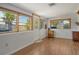Bright sunlit living room featuring hardwood floors and many windows at 568 Sheridan Dr, Venice, FL 34293
