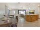 Open floor plan showcasing the dining and living room areas with natural lighting throughout at 568 Sheridan Dr, Venice, FL 34293