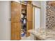 Open pantry showcasing ample storage space behind sliding barn doors with shelving at 568 Sheridan Dr, Venice, FL 34293