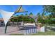Inviting park area featuring shaded picnic tables, a drinking fountain, bike rack, and lush surroundings at 568 Sheridan Dr, Venice, FL 34293