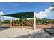 Fun playground with slides, climbing structures, and shaded areas, perfect for children to play and enjoy the outdoors at 568 Sheridan Dr, Venice, FL 34293