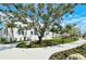 Manicured streetscape showcasing modern homes with lush landscaping and inviting pathways, creating a picturesque community at 568 Sheridan Dr, Venice, FL 34293