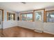 Sunroom showcasing natural lighting and offering views of the surrounding neighborhood at 568 Sheridan Dr, Venice, FL 34293