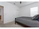 This bedroom boasts neutral walls and carpeting, plus a large window and a walk-in closet at 5759 Bungalow Grove Ct, Palmetto, FL 34221