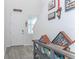 Inviting entryway featuring a white door, wood-look tile, and decorative wall pieces at 5759 Bungalow Grove Ct, Palmetto, FL 34221