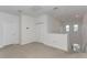 Spacious loft area with neutral carpet, recessed lighting, a double-door closet, and lots of natural light at 5759 Bungalow Grove Ct, Palmetto, FL 34221
