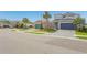 A neighborhood street view with well-maintained homes and manicured lawns at 5759 Bungalow Grove Ct, Palmetto, FL 34221