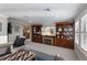 Upstairs living room with fireplace and custom shelving units at 5772 Bluestar Ct, Bradenton, FL 34211
