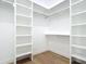 Organized walk-in closet with built-in shelving at 5792 Nymph Ave, North Port, FL 34288