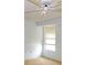 Bedroom features neutral carpet, simple ceiling fan, and window for natural light at 6309 35Th W Ave, Bradenton, FL 34209