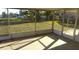 Enclosed lanai overlooking the serene backyard and tranquil water feature at 6309 35Th W Ave, Bradenton, FL 34209