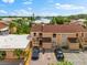 Aerial view of the tan condos with brown roofs, and parking at 6348 7Th W Ave # 6348, Bradenton, FL 34209