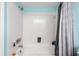 Clean bathroom with a white tiled tub and a modern gray curtain at 6348 7Th W Ave # 6348, Bradenton, FL 34209