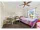Bedroom featuring a ceiling fan, large window, and play kitchen at 6348 7Th W Ave # 6348, Bradenton, FL 34209