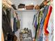 Walk-in closet featuring neatly organized clothing, shoe rack, and ample storage space at 6348 7Th W Ave # 6348, Bradenton, FL 34209