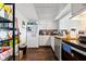 Bright kitchen with stainless steel appliances, wood-look countertops, and dark hardwood flooring at 6348 7Th W Ave # 6348, Bradenton, FL 34209