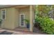 Side entrance, featuring brick landing, and lush plants at 640 N Osprey Ave, Sarasota, FL 34236