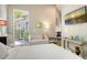 A quaint bedroom with a comfortable seating area and a bright view to the tropical outdoors at 640 N Osprey Ave, Sarasota, FL 34236