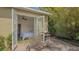 Bedroom access to the backyard with open French doors, a seating area, and a grill for entertaining at 640 N Osprey Ave, Sarasota, FL 34236