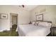Bedroom with white shuttered windows and a comfortable looking bed with plush pillows at 640 N Osprey Ave, Sarasota, FL 34236