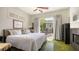 Cozy bedroom with a comfortable bed and an open patio view through the glass doors at 640 N Osprey Ave, Sarasota, FL 34236
