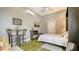 Comfortable bedroom featuring a ceiling fan, tv, and an outdoor view at 640 N Osprey Ave, Sarasota, FL 34236